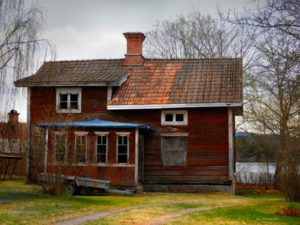 worn-red-wooden-house